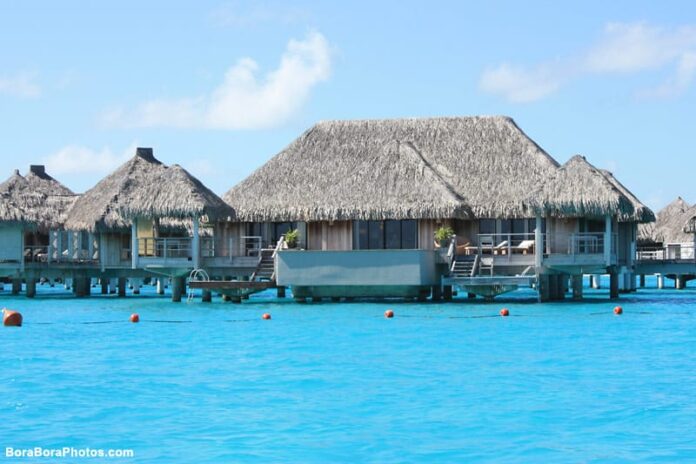 View of the large luxury overwater bungalows at the St Regis Resort.