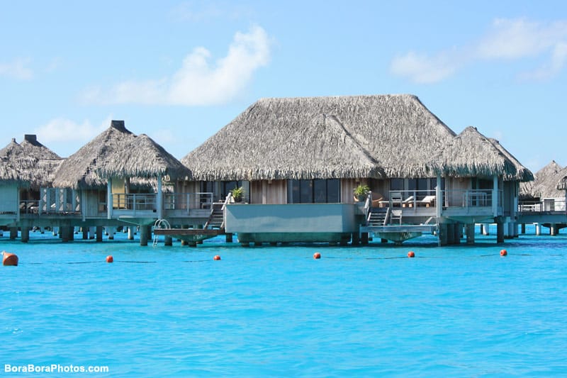 View of the large luxury overwater bungalows at the St Regis Resort