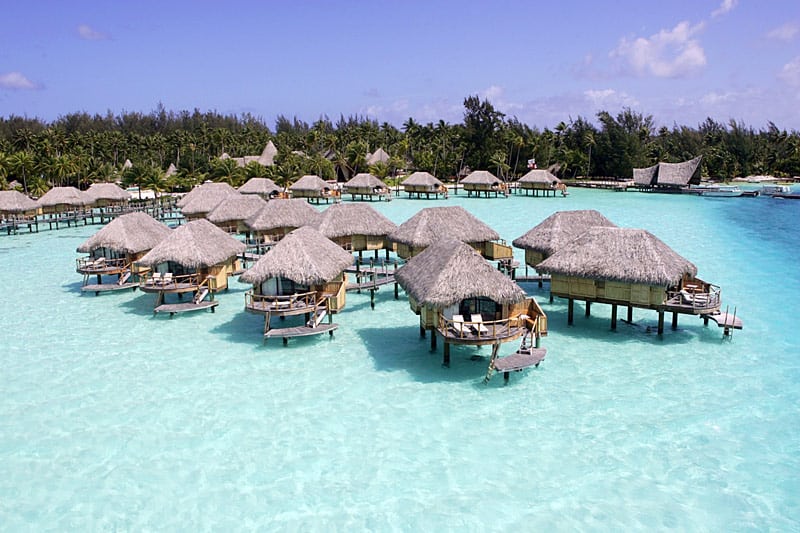 View of several overwater bungalows at the Pearl Beach Resort