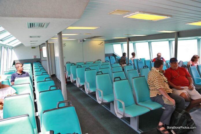 Inside view of seats and passengers taking the boat shuttle to and from the airport.