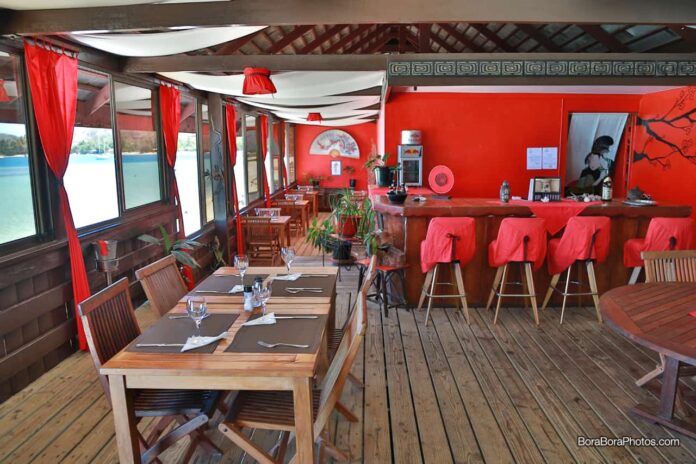 Red walls are an Asian influence view of the restaurant Tiki Bar.