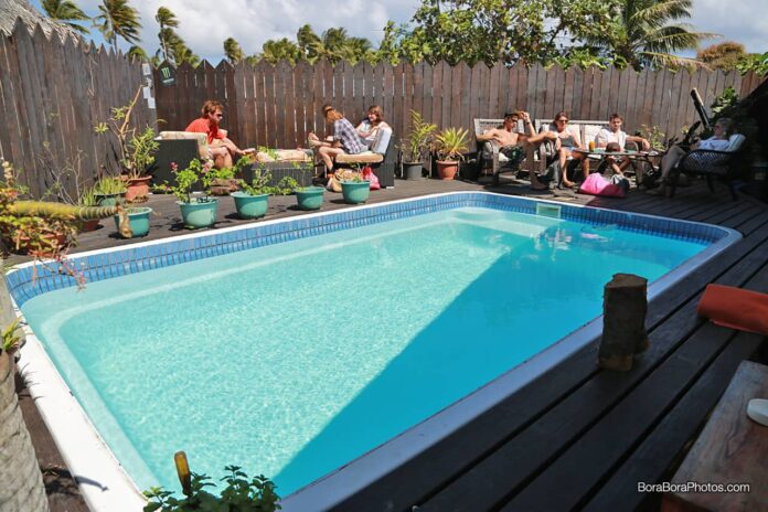 Pool with lounge chairs at the Fare Manuia bar.