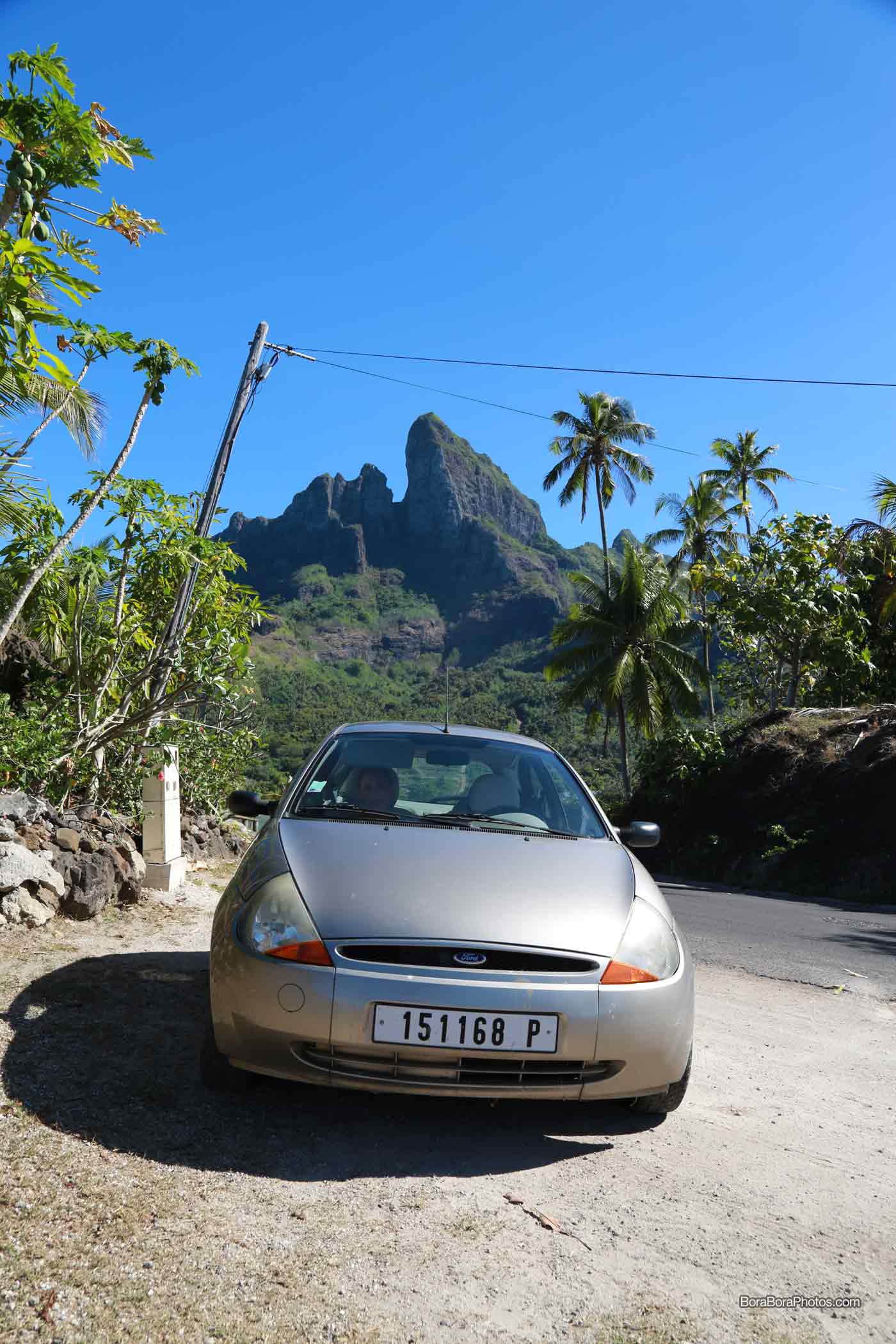 Picture of a car in Bora Bora with a view of Mt. Otemanu in the background
