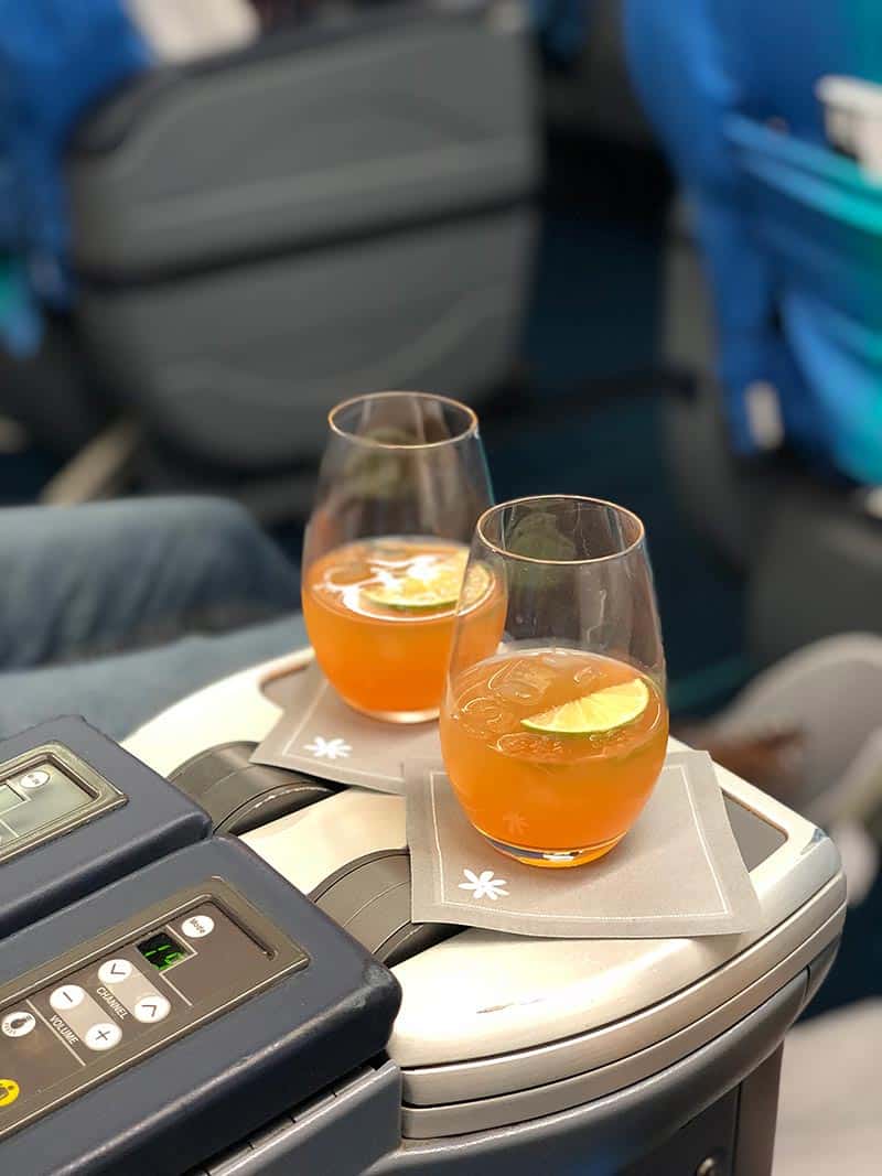 Two tropical juice drinks in business class